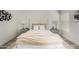 Serene bedroom with upholstered headboard, neutral bedding, and matching nightstands at 2233 E Behrend Dr # 210, Phoenix, AZ 85024