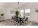 Contemporary dining room with modern table set, stylish lighting, and natural light from the windows at 2233 E Behrend Dr # 210, Phoenix, AZ 85024