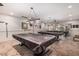 Large game room with multiple pool tables and ample lighting is perfect for entertainment and recreation at 2233 E Behrend Dr # 210, Phoenix, AZ 85024
