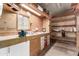 Functional garage with workbench and storage shelving at 2233 E Behrend Dr # 210, Phoenix, AZ 85024