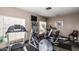 Well-lit gym with treadmills, elliptical machines and a mounted TV for residents enjoyment at 2233 E Behrend Dr # 210, Phoenix, AZ 85024
