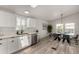 Updated kitchen featuring quartz countertops, stainless appliances, and an adjacent dining area at 2233 E Behrend Dr # 210, Phoenix, AZ 85024