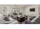 Inviting living room with plush seating, stylish decor, and bright natural light from the large windows at 2233 E Behrend Dr # 210, Phoenix, AZ 85024