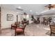 Spacious lounge area with stone flooring, comfortable seating, and natural light offers a relaxing social space at 2233 E Behrend Dr # 210, Phoenix, AZ 85024