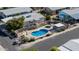 Birds eye view of a community pool with stone surround, hot tub and desert landscaping at 2233 E Behrend Dr # 210, Phoenix, AZ 85024