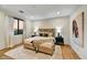Cozy bedroom with a queen-size bed and large artwork at 9930 E Miramonte Dr, Scottsdale, AZ 85262
