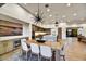 Open dining room with wood table and modern chandelier at 9930 E Miramonte Dr, Scottsdale, AZ 85262
