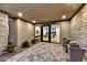 Modern entryway with stone flooring and potted plants at 9930 E Miramonte Dr, Scottsdale, AZ 85262
