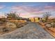 Stunning curb appeal with a paved driveway and desert landscaping at 9930 E Miramonte Dr, Scottsdale, AZ 85262