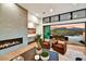 Living room with fireplace and sliding doors to backyard at 9930 E Miramonte Dr, Scottsdale, AZ 85262