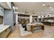 Spacious living room with fireplace and large windows offering scenic views at 9930 E Miramonte Dr, Scottsdale, AZ 85262