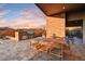 Outdoor kitchen and dining area with mountain views at 9930 E Miramonte Dr, Scottsdale, AZ 85262