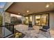 Private patio with seating area and view of surrounding landscape at 9930 E Miramonte Dr, Scottsdale, AZ 85262