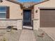 Front entry with brick walkway and wrought-iron gate at 17756 W Coolidge St, Goodyear, AZ 85395