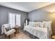 Bedroom with daybed and window shutters at 19219 N 33Rd Ave, Phoenix, AZ 85027
