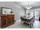 Bright dining room with a wood table, floral chairs, and access to the patio at 19219 N 33Rd Ave, Phoenix, AZ 85027