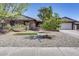 Brick ranch house with a landscaped front yard, and a two-car garage at 19219 N 33Rd Ave, Phoenix, AZ 85027