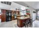 Spacious kitchen featuring granite countertops and dark wood cabinetry at 19219 N 33Rd Ave, Phoenix, AZ 85027