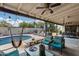 Relaxing covered patio with pool view, hammock, and comfortable seating at 19219 N 33Rd Ave, Phoenix, AZ 85027