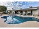 Inviting backyard pool with lounge chairs, covered patio, and outdoor grill, perfect for relaxation and entertainment at 19219 N 33Rd Ave, Phoenix, AZ 85027