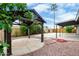 Backyard showcases charming gazebo, patio, lush landscaping, and a palm tree at 3425 W Acoma Dr, Phoenix, AZ 85053