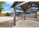 Charming backyard featuring a gazebo, covered patio, and lush greenery at 3425 W Acoma Dr, Phoenix, AZ 85053