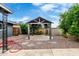 Landscaped backyard featuring a quaint gazebo, stepping stones and lush greenery at 3425 W Acoma Dr, Phoenix, AZ 85053