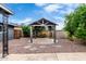 Charming backyard gazebo with stone detailing, surrounded by lush greenery and a well-maintained landscape at 3425 W Acoma Dr, Phoenix, AZ 85053