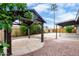 Beautiful backyard featuring a gazebo, basketball court, covered patio, and lush landscaping, creating a perfect outdoor oasis at 3425 W Acoma Dr, Phoenix, AZ 85053