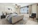 Relaxing bedroom featuring a ceiling fan, stylish furniture, and a calming, patterned rug for a serene ambiance at 3425 W Acoma Dr, Phoenix, AZ 85053