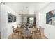 Bright dining room featuring a wood table with seating for six and modern decor at 3425 W Acoma Dr, Phoenix, AZ 85053