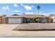 Charming single-story home featuring a spacious driveway and desert landscaping for low maintenance appeal at 3425 W Acoma Dr, Phoenix, AZ 85053