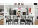 Charming kitchen with white cabinets and a breakfast bar, ideal for casual dining at 3425 W Acoma Dr, Phoenix, AZ 85053