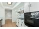 Well-lit kitchen with white cabinetry, modern appliances, and ample counter space at 3425 W Acoma Dr, Phoenix, AZ 85053