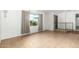 Bright and airy living area with tile flooring, a large window, and neutral decor, providing a blank canvas for personalization at 3425 W Acoma Dr, Phoenix, AZ 85053
