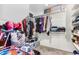 Large walk-in closet with ample shelving and hanging space at 25677 W Siesta Way, Buckeye, AZ 85326