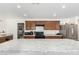 Modern kitchen with stainless steel appliances and ample counter space at 25677 W Siesta Way, Buckeye, AZ 85326