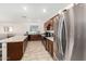 Open concept kitchen with island and stainless steel appliances at 25677 W Siesta Way, Buckeye, AZ 85326