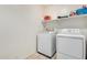 Laundry room with washer, dryer and shelving at 25677 W Siesta Way, Buckeye, AZ 85326