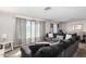 Spacious living room with sectional sofa and large windows at 25677 W Siesta Way, Buckeye, AZ 85326