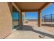 Covered patio overlooking the backyard with trampoline at 25677 W Siesta Way, Buckeye, AZ 85326