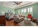 Relaxing main bedroom with a tray ceiling, hardwood floors, and plantation shutters at 6125 E Hodges St, Cave Creek, AZ 85331