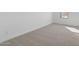 A bedroom with neutral carpet, paint and baseboards at 7552 W Park St, Laveen, AZ 85339