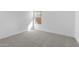 Simple bedroom with neutral carpet and a window letting in natural light at 7552 W Park St, Laveen, AZ 85339