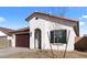 Charming single-story home with a two-car garage, stucco walls, a brown tile roof, and desert landscaping at 7552 W Park St, Laveen, AZ 85339