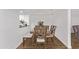 Cozy dining room featuring a dining table with chairs, a bench, and floral accents at 728 W Grove Cir, Mesa, AZ 85210