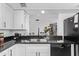 Well-maintained kitchen with granite countertops, stylish sink, and view into the dining area at 728 W Grove Cir, Mesa, AZ 85210