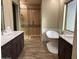 Large bathroom with soaking tub, walk-in shower, and double vanity at 29923 W Melvin St, Buckeye, AZ 85396
