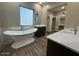 Spa-like bathroom with soaking tub, walk-in shower, and double vanity at 29923 W Melvin St, Buckeye, AZ 85396