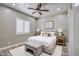Serene bedroom featuring a comfortable king-sized bed and ambient lighting, perfect for relaxation at 29923 W Melvin St, Buckeye, AZ 85396